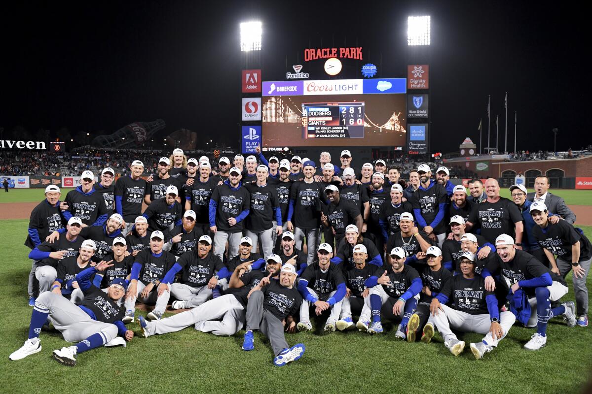 The Dodgers pose for a team photo after their series-clinching win over the Giants.