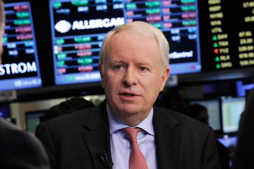 Allergan CEO David Pyott is interviewed on the floor of the New York Stock Exchange Monday, Nov. 17, 2014. Allergan has reached a friendly deal to be acquired by Actavis PLC in a deal valued at US$66 billion -- blocking an attempted hostile takeover by a Canadian company and its U.S. backer. (AP Photo/Richard Drew) ** Usable by LA, DC, CGT and CCT Only **