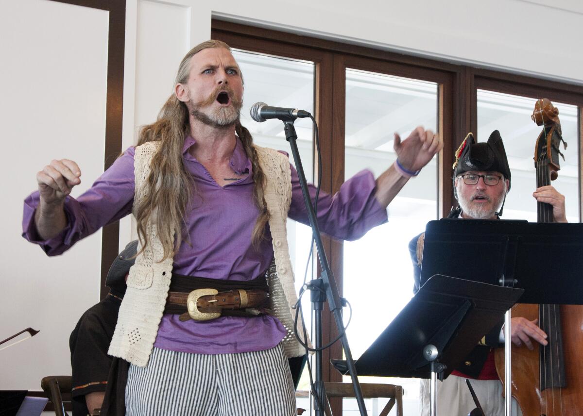 Singer Spoo, and leader of Hutchins Consort Joe McNalley at the 2022 Hutchins gala held at Newport Harbor Yacht Club.