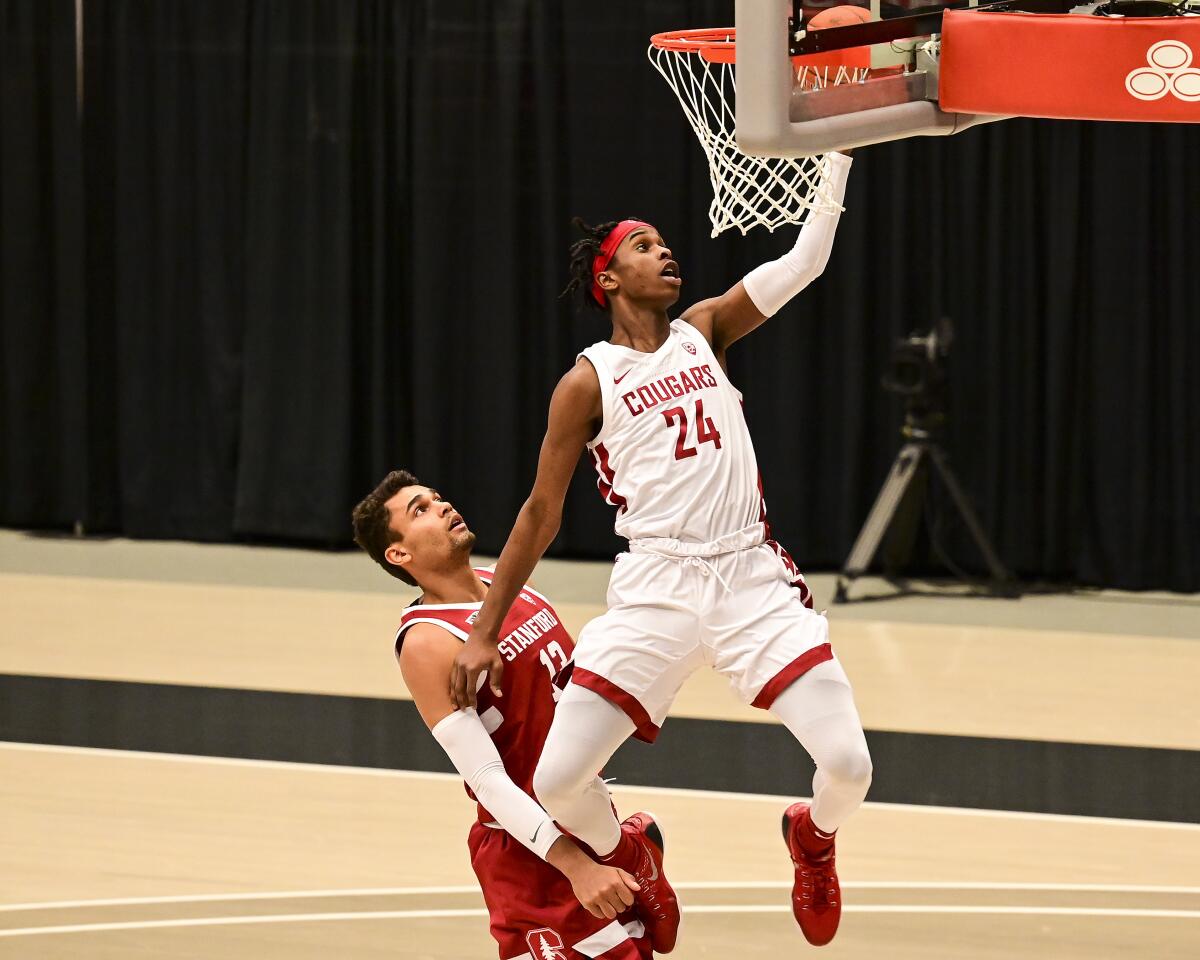 Washington State's Noah Williams attempts a layup against Stanford's Oscar da Silva on Feb. 20, 2021.