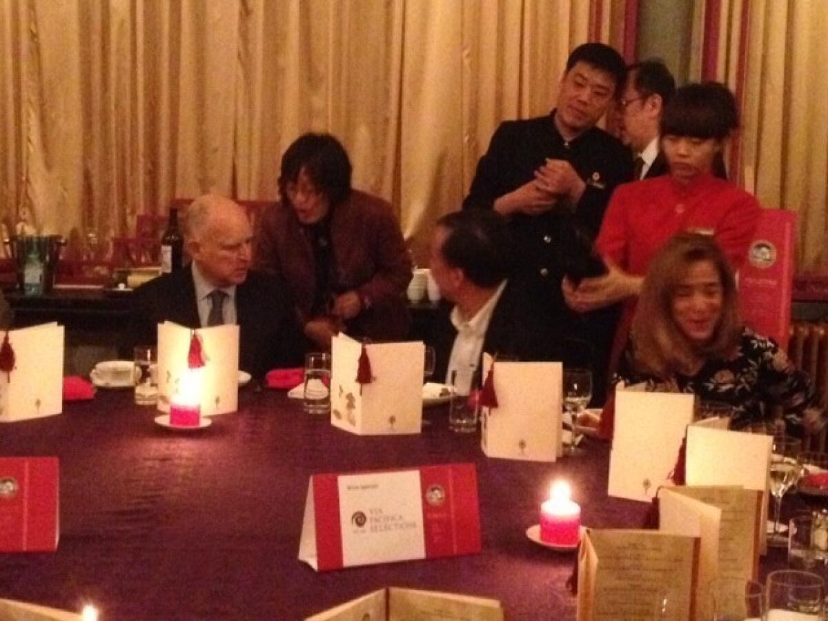 Gov. Jerry Brown dines with delegates at the China Club in Beijing.