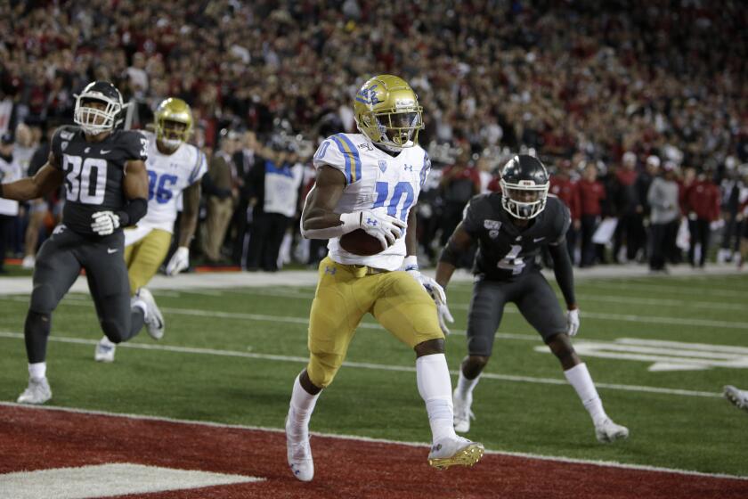 UCLA wide receiver Demetric Felton (10) scores the go ahead touchdown during the second half of an NCAA college football game against Washington State in Pullman, Wash., Saturday, Sept. 21, 2019. UCLA won 67-63. (AP Photo/Young Kwak)