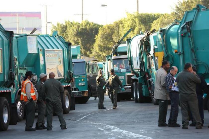 Sanitation workers gather last month at a demonstration in Boyle Heights over stalled contract negotiations.