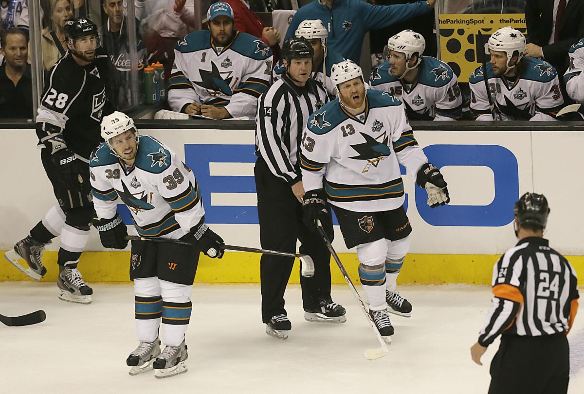 Sharks forward Raffi Torres yells at referee Stephen Walcom after he is called for a penalty after hitting Kings center Jarret Stoll during the second period of a playoff game in 2013.