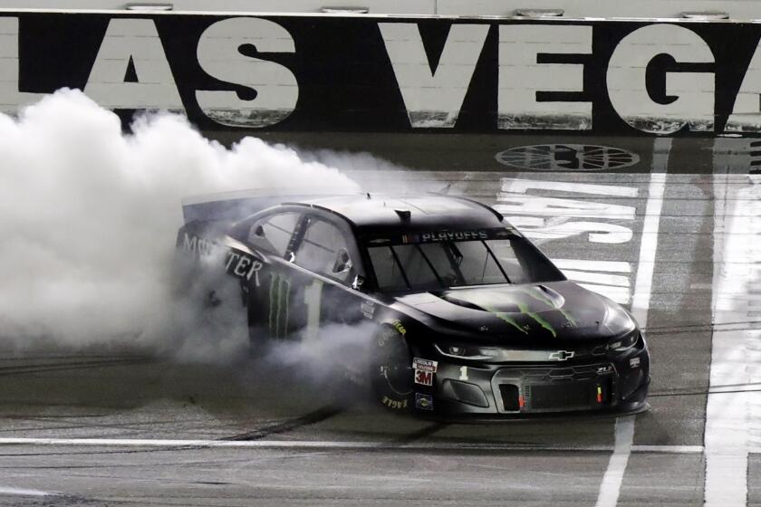 Kurt Busch performs a burnout after winning a NASCAR Cup Series auto race.