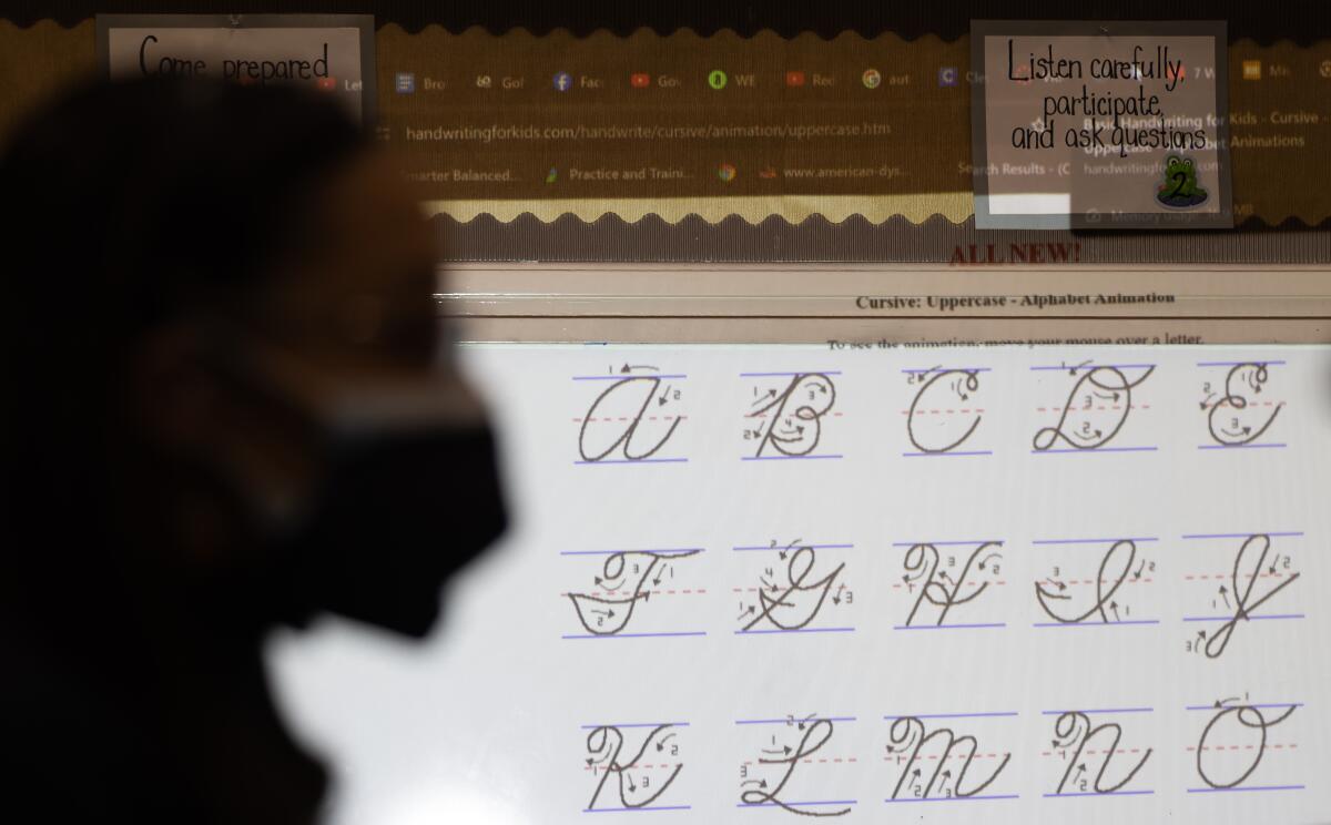 Fourth-grade students are taught cursive at a school in Pasadena on Dec. 14. 