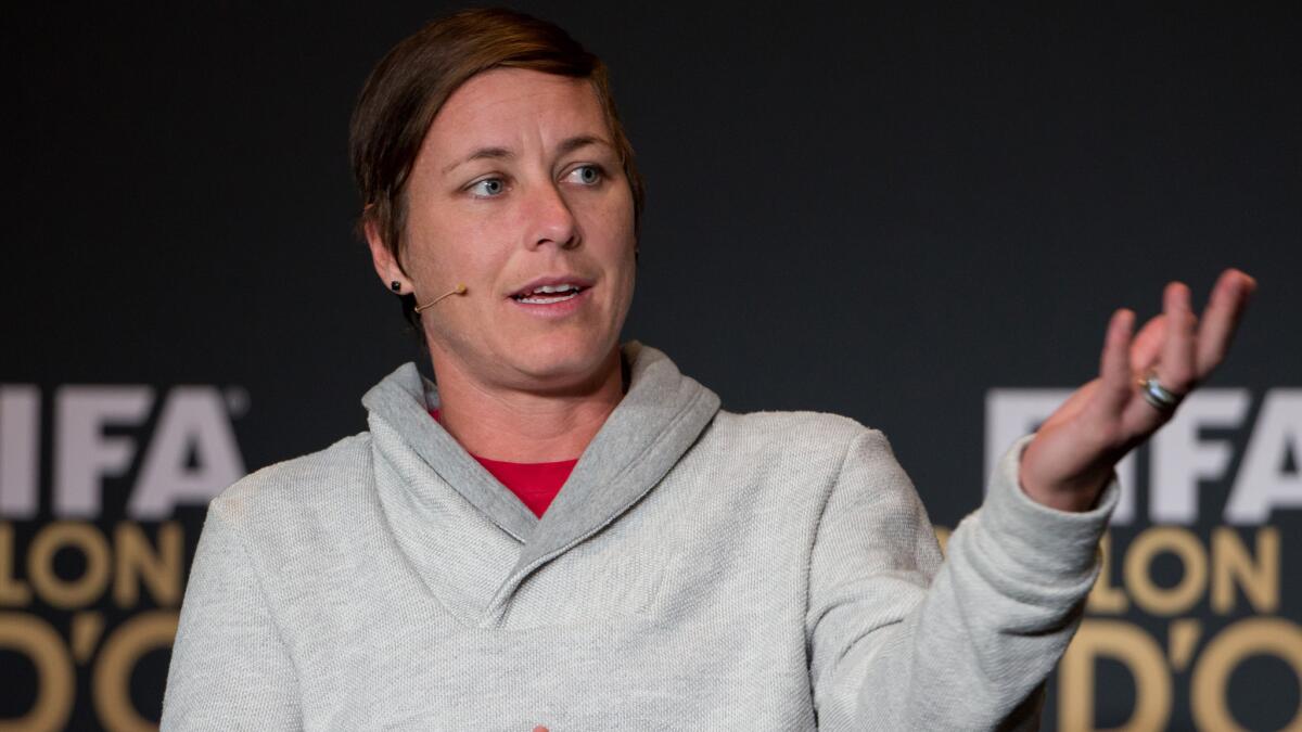 U.S. national team forward Abby Wambach speaks during a news conference in Zurich, Switzerland, on Jan. 12. A group of women's soccer players has dropped its discrimination lawsuit against FIFA.