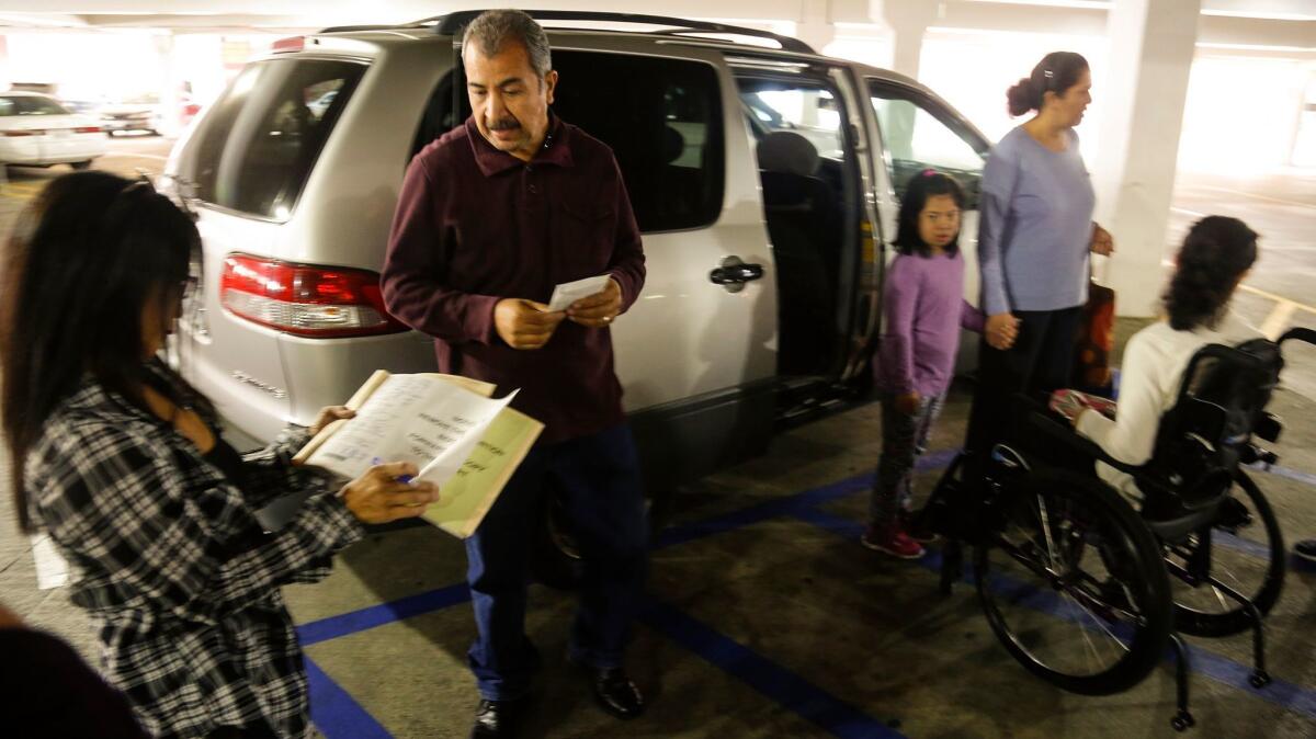 An undercover officer with the Department of Motor Vehicles issues a citation to a family parking in a disabled parking spot with an invalid out-of-state placard.