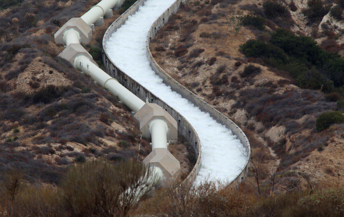 A photograph shot in July shows water flowing down the Los Angeles Aqueduct's Cascades section in Sylmar.
