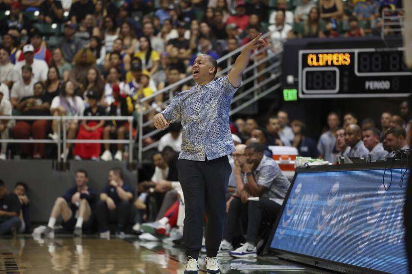 Los Angeles Clippers head coach Tyronn Lue reacts to play as his team takes on the Golden State Warriors during the fourth quarter of an NBA exhibition basketball game on Saturday, Oct. 5, 2024 in Honolulu. (AP Photo/Marco Garcia)