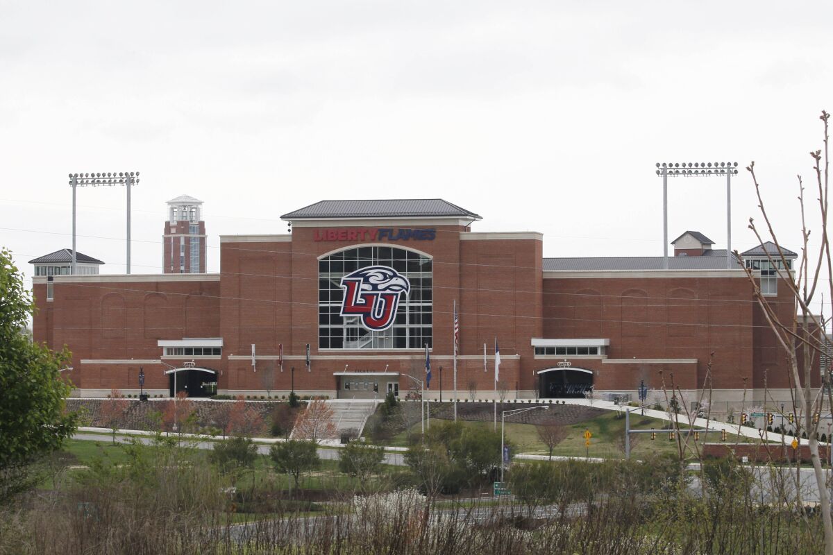 FILE - Liberty University's football stadium is empty as students were welcomed back to the university's campus, March 24, 2020, in Lynchburg, Va. A settlement has been reached in a lawsuit twelve women brought last summer against Liberty University, according to court documents filed, Wednesday, May 11, 2022. (AP Photo/Steve Helber, File)