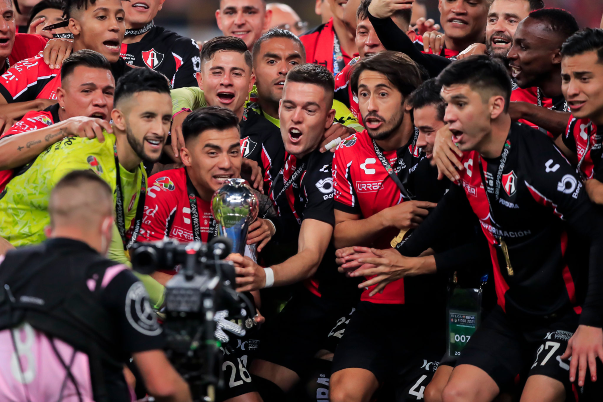 Atlas players celebrate after defeating León for the Liga MX title Sunday night.
