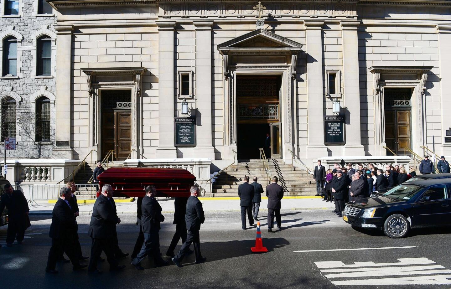 The casket carrying late actor Philip Seymour Hoffman arrives at St. Ignatius of Loyola Church.