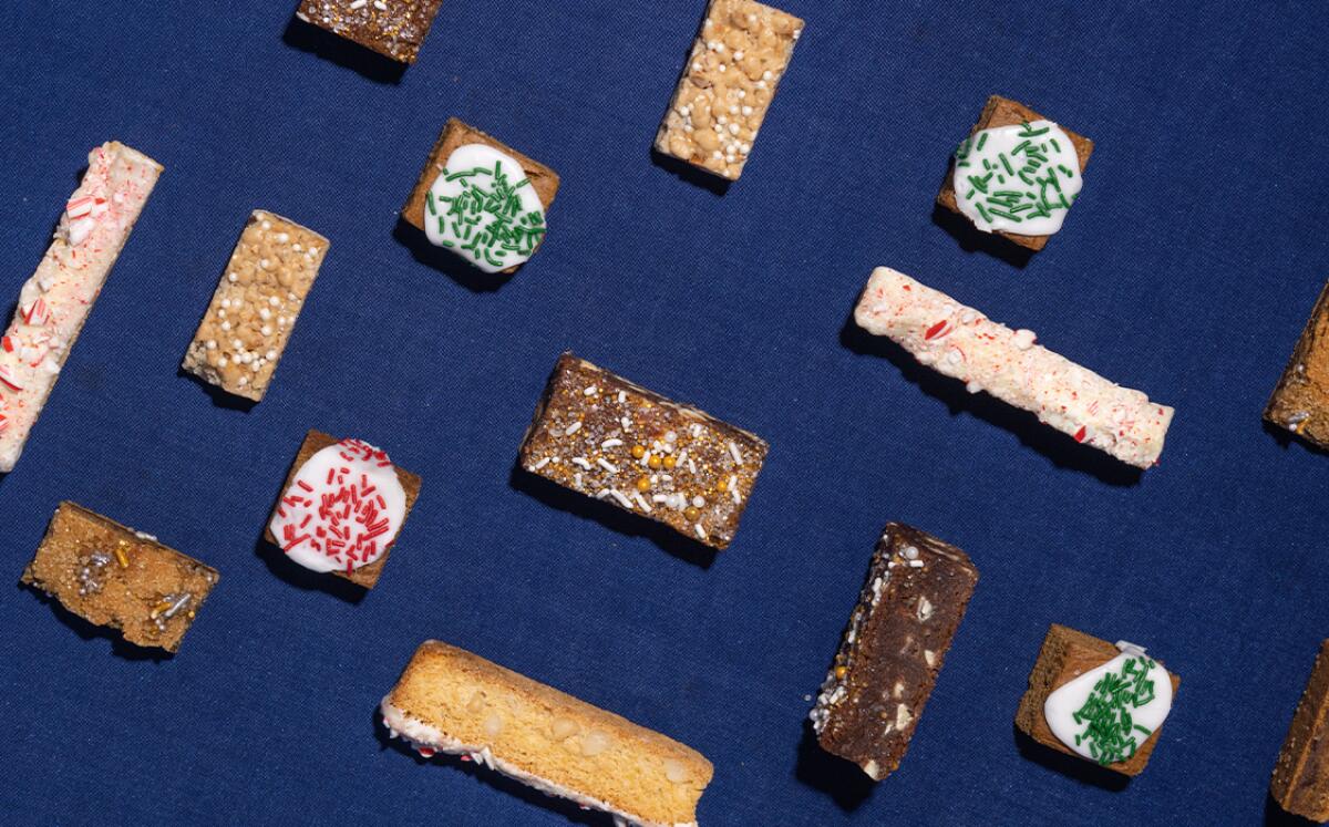 Overhead view of cookies on a blue cloth.