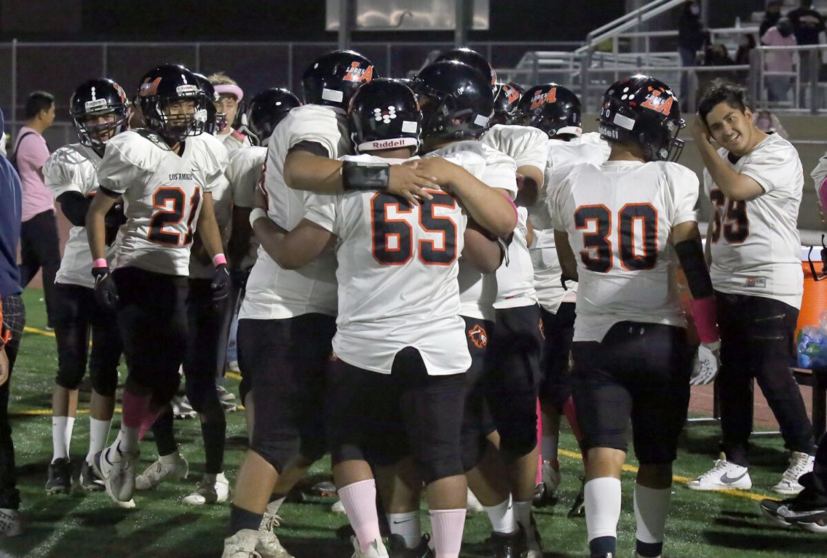 Los Amigos players celebrate after defeating Bolsa Grande.