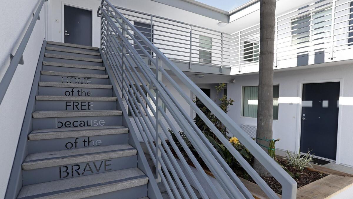 The words "Home of the free because of the brave" are inscribed on a stairway at the Cove Apartments, which houses military veterans and low-income senior citizens at 6001 Coast Blvd. in Newport Beach.