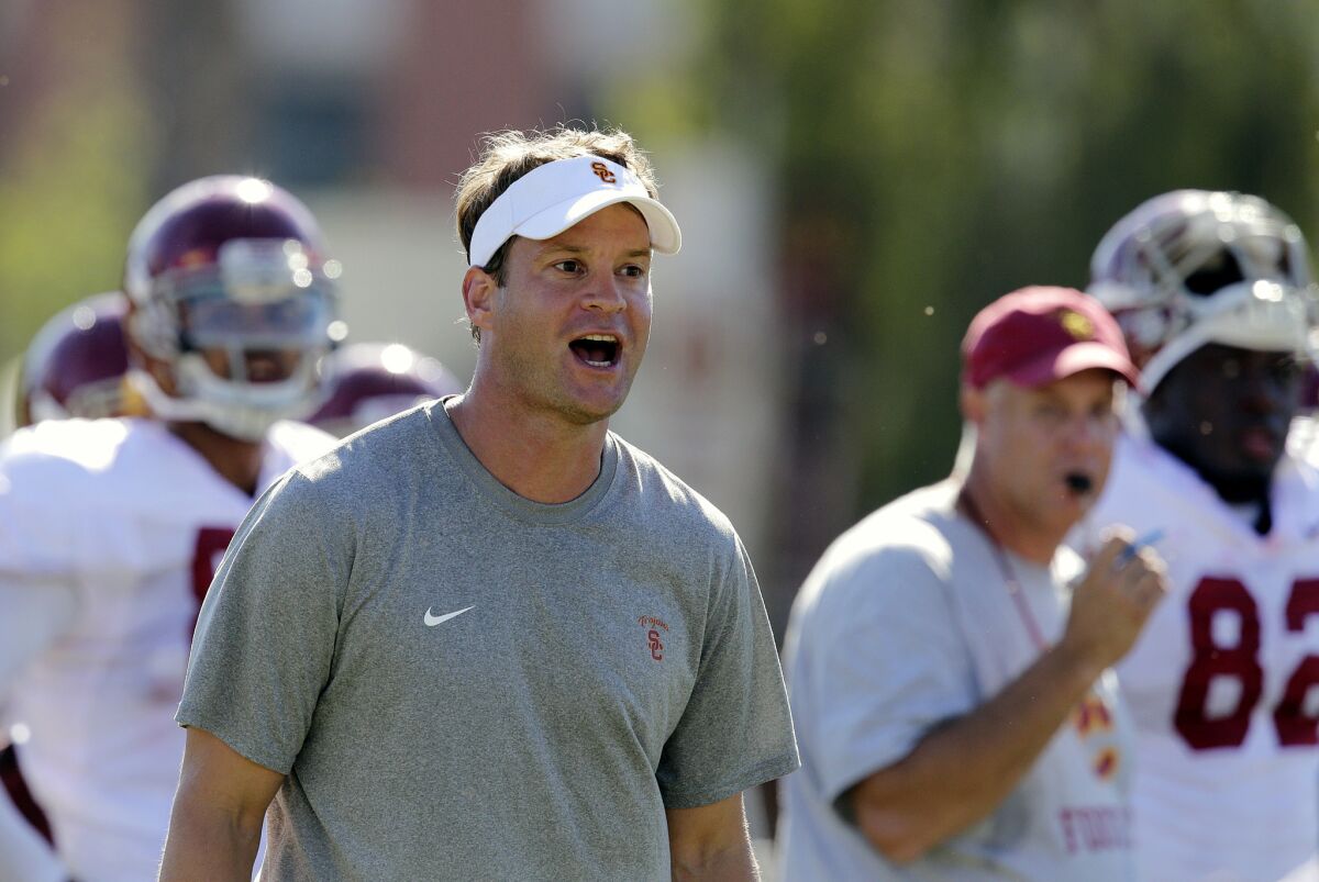 USC Coach Lane Kiffin directs his players during summer camp, when the Trojans were ranked No. 25 in the nation in a preseason poll.