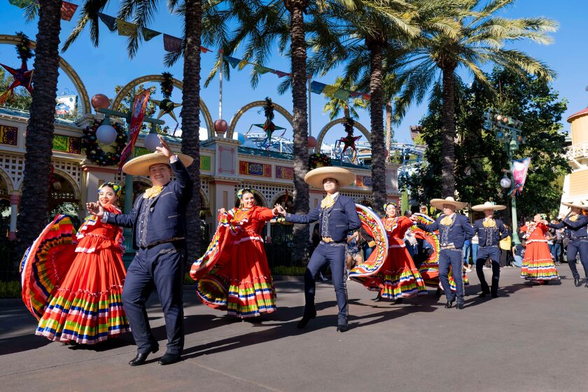 Disney's ¡Viva Navidad! street parade is a boisterous celebration of Latin music and dance.