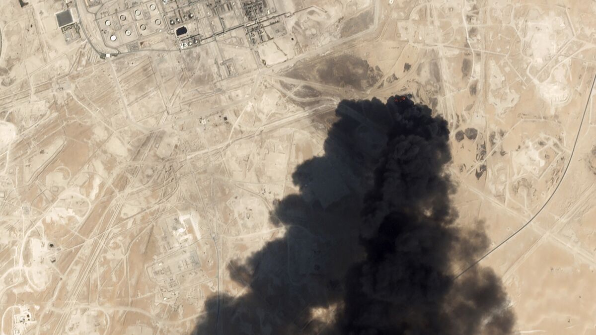This satellite image from Planet Labs Inc. shows thick black smoke rising from Saudi Aramco's Abqaiq oil processing facility on Saturday in Buqyaq, Saudi Arabia.