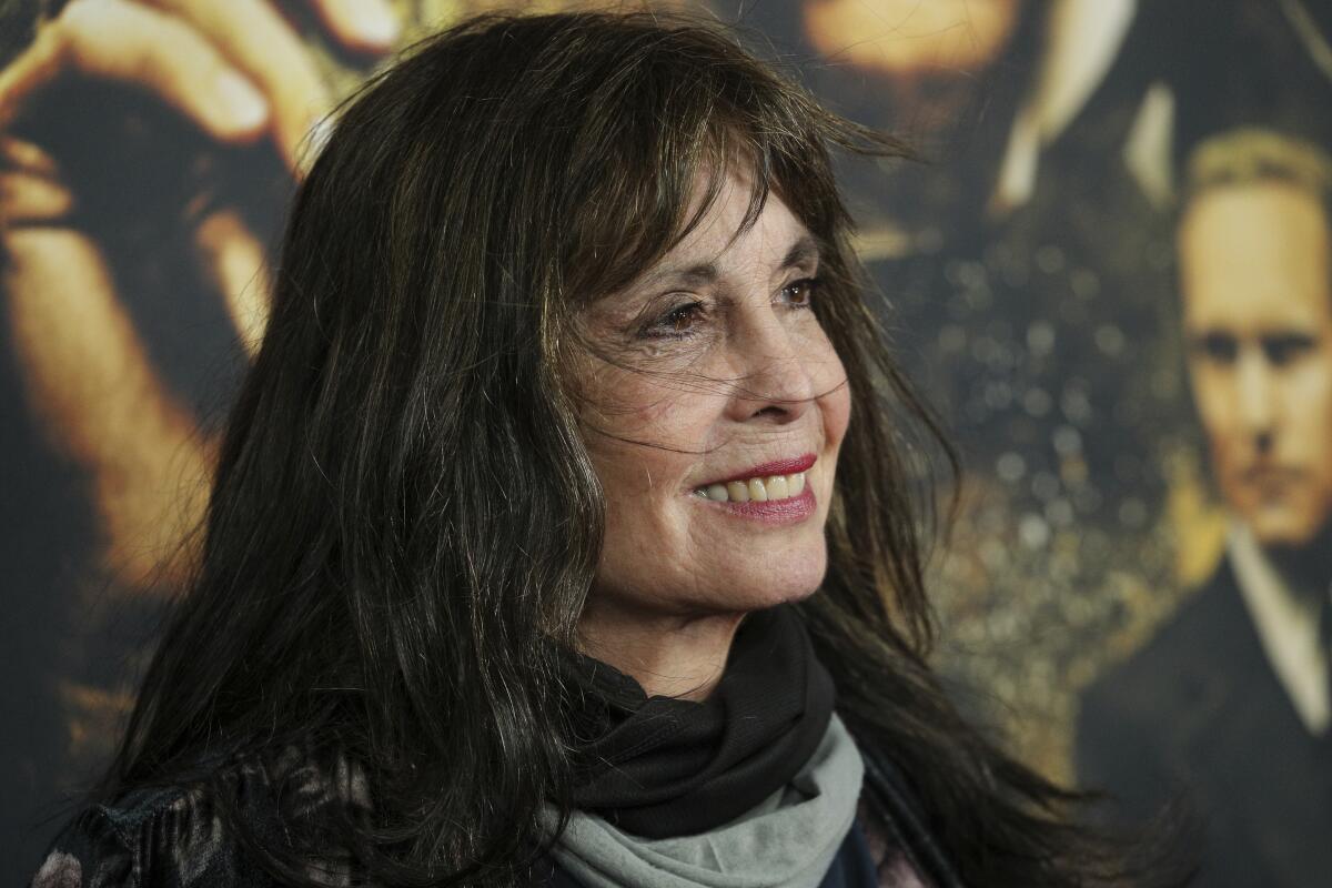 A woman arrives at a red-carpet event