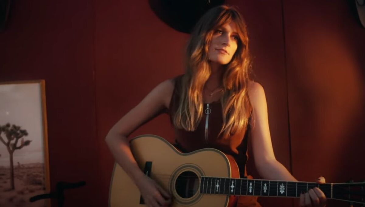 Country singer Anna Vaus set up a mock bar in a Poway field to record her new single, "Girl in a Bar."