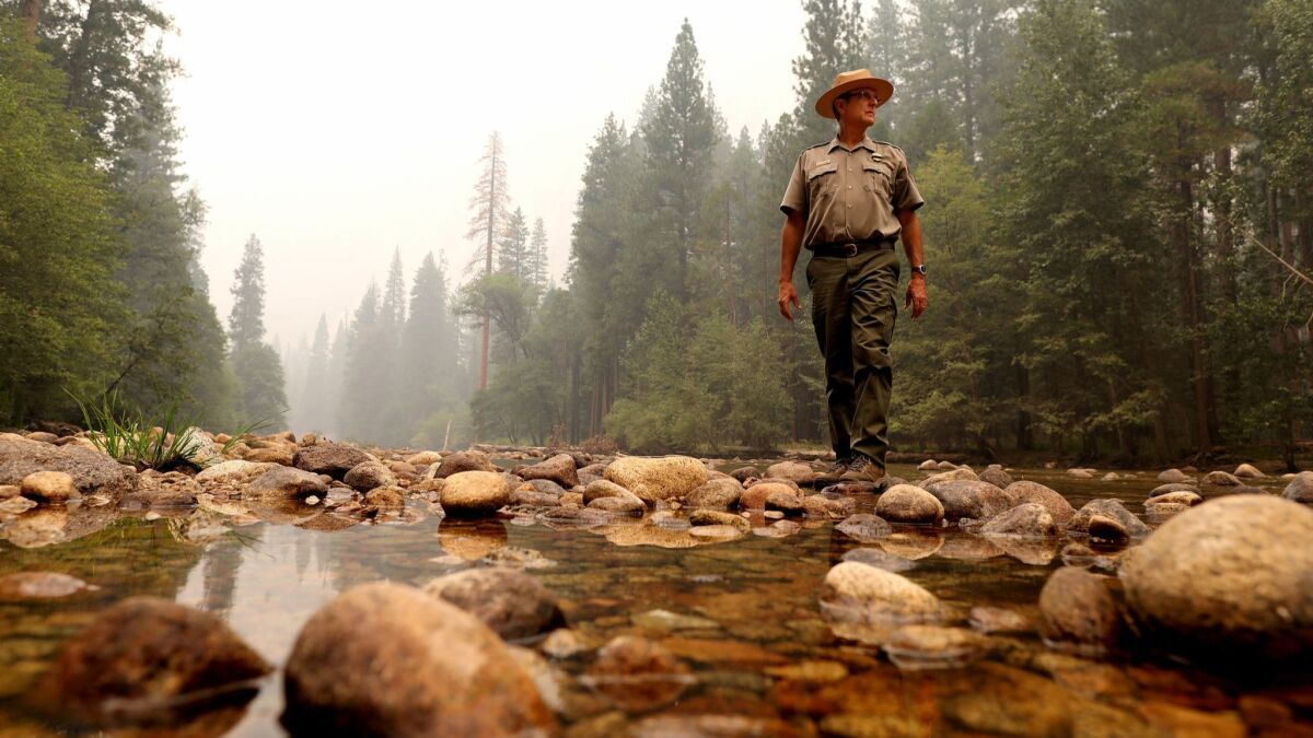 Scott Gediman, a Yosemite National Park spokesman, on the Merced River next to the temporarily closed Lower Pines camp in Yosemite Valley.
