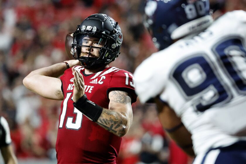 North Carolina State's Devin Leary (13) prepares to pass the ball during the first half of an NCAA college football game against Connecticut in Raleigh, N.C., Saturday, Sept. 24, 2022. (AP Photo/Karl B DeBlaker)