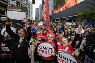 Los Angeles, CA - May 26: Workers from multiple unions rally together at 12th Street and Figueroa on Friday, May 26, 2023 in Los Angeles, CA. (Brian van der Brug / Los Angeles Times)