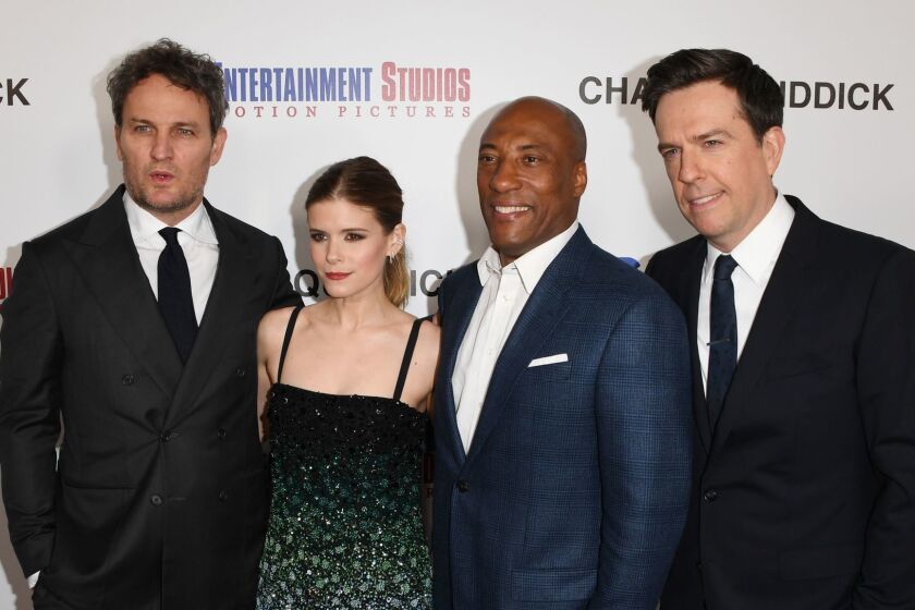 (FILES) In this file photo taken on March 28, 2018 (L-R) Jason Clarke, Kate Mara, Entertainment Studios CEO/Co-Founder Byron Allen and Ed Helms arrive on the red carpet for the premiere of 'Chappaquiddick' at the Samuel Goldwyn Theater in Beverly Hills, California. The accident at a bridge on Chappaquiddick Island, an upscale resort off Cape Cod, indelibly stained Kennedy's reputation and destroyed his chances of entering the White House. "It was the event that changed the course of Teddy Kennedy's career," said John Curran, the director of "Chappaquiddick," a new movie delving into the mysterious events surrounding a tragedy that has enthralled America for half a century. / AFP PHOTO / Mark RalstonMARK RALSTON/AFP/Getty Images ** OUTS - ELSENT, FPG, CM - OUTS * NM, PH, VA if sourced by CT, LA or MoD **