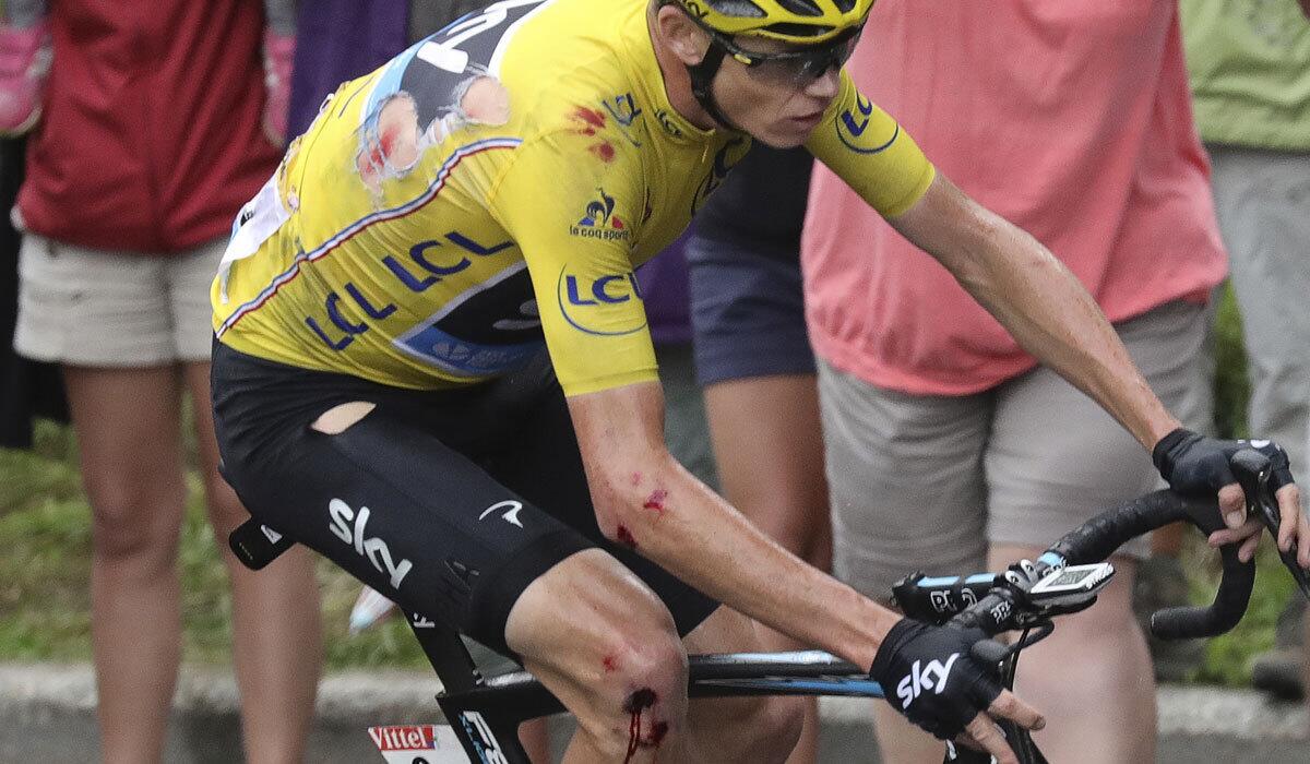 Chris Froome continues racing after a crash during Stage 19 of the Tour de France.
