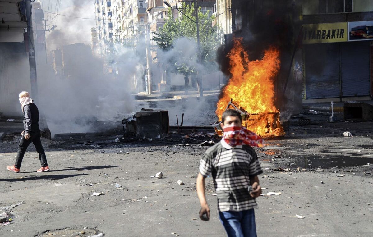 Kurdish protesters clash with Turkish riot police in Diyarbakir on Oct. 8.