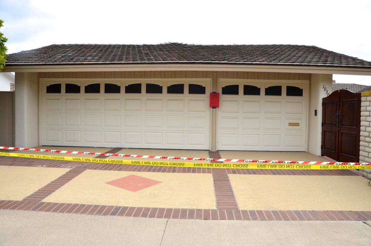 A red tag appears on the front of 1930 Galaxy Drive in Newport Beach. 