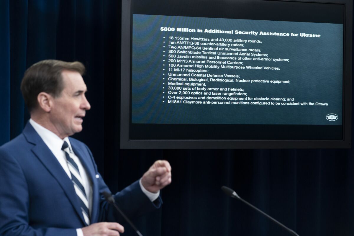 Pentagon spokesman John Kirby speaks during a media briefing at the Pentagon, Wednesday, April 13, 2022, in Washington. Behind him is a list of security items the U.S. is providing to Ukraine. (AP Photo/Alex Brandon)