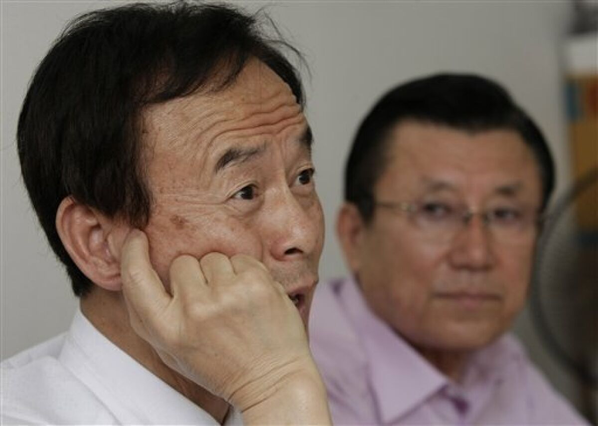 In this June 9, 2010, photo, Lee Won-woo, left, who was 2 years old when his parents and older sister were killed with some 70 other refugees in an attack by a U.S. aircraft near Kyongju, talks as Oh Won-rok, head of a national association of 80 survivors' groups, looks on during an interview with The Associated Press in Seoul, South Korea. In a political about-face, ending a four-year inquiry, a South Korean commission investigating the U.S. military's large-scale killing of refugees and other civilians in the Korean War has ruled the Americans in case after case acted out of military necessity. Survivors like Lee disagree. "Those U.S. warplanes attacked us even though they knew we were refugees. That's a war crime. They cannot just cover it up," he says. (AP Photo/Ahn Young-joon)