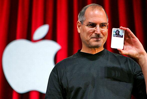 Jobs holds up the new iPod, showing an episode of hit television show "Desperate Housewives." Apple Computer Inc.'s momentum in 2005 seemed unstoppable as it launched one hit product after another: the iPod Shuffle, the Mac Mini, the iPod Nano, a video-playing iPod and TV shows for sale on its iTunes store.