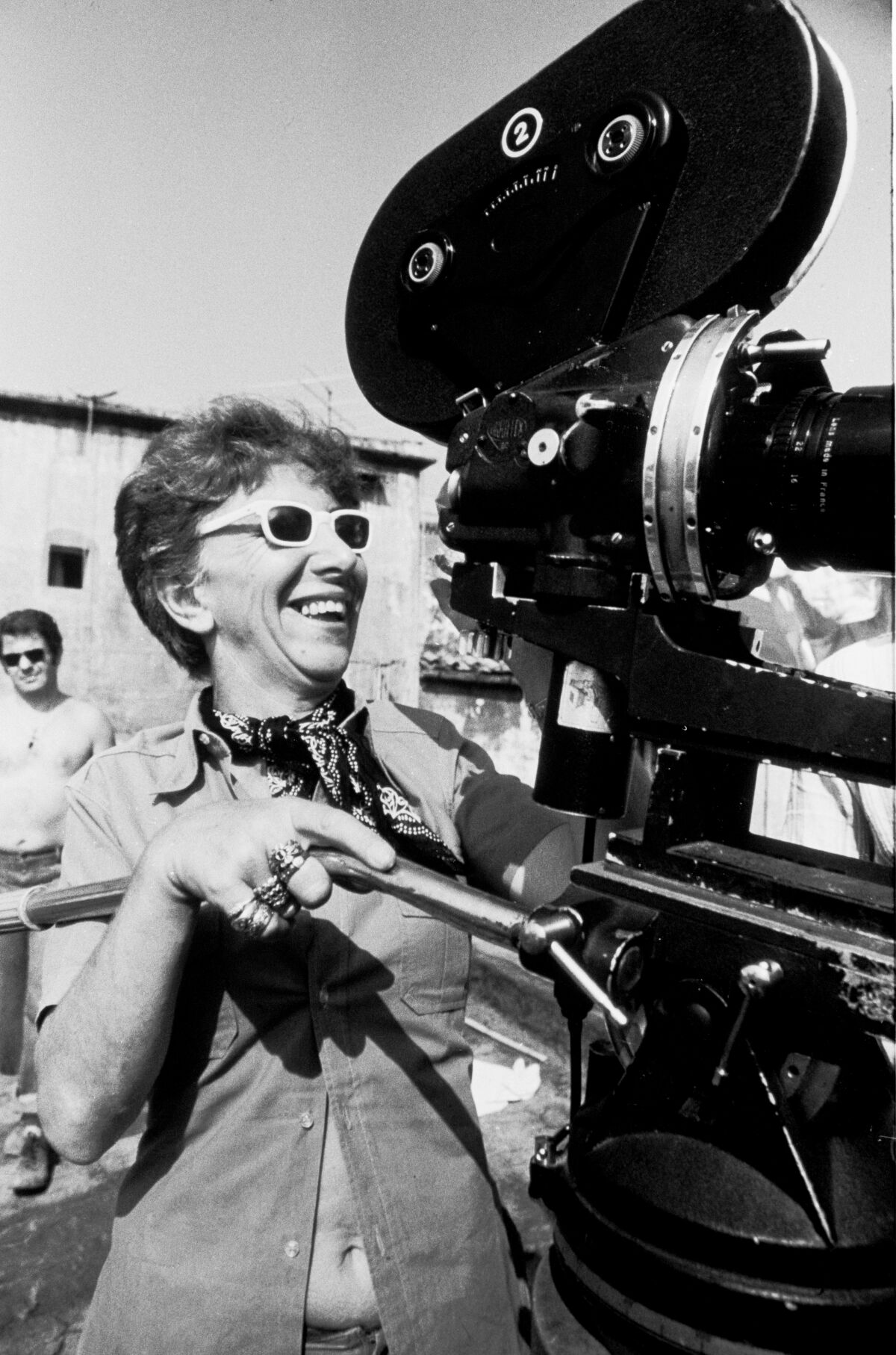A woman behind a movie camera.