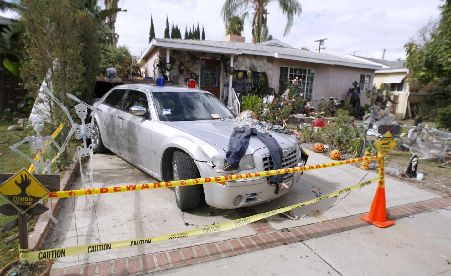 Tina Schaefer and Arnulfo Padilla decorated the home, winner of the Burbank Halloween Decorating Contest, at 1505 N. Valley St. in Burbank, shown on Friday, October 28, 2016. There are a variety of scary scenes throughout the front yard, which include a scary clown and a gorilla driving a car that has hit a character. The display also includes actual skeletal remains of a boar.