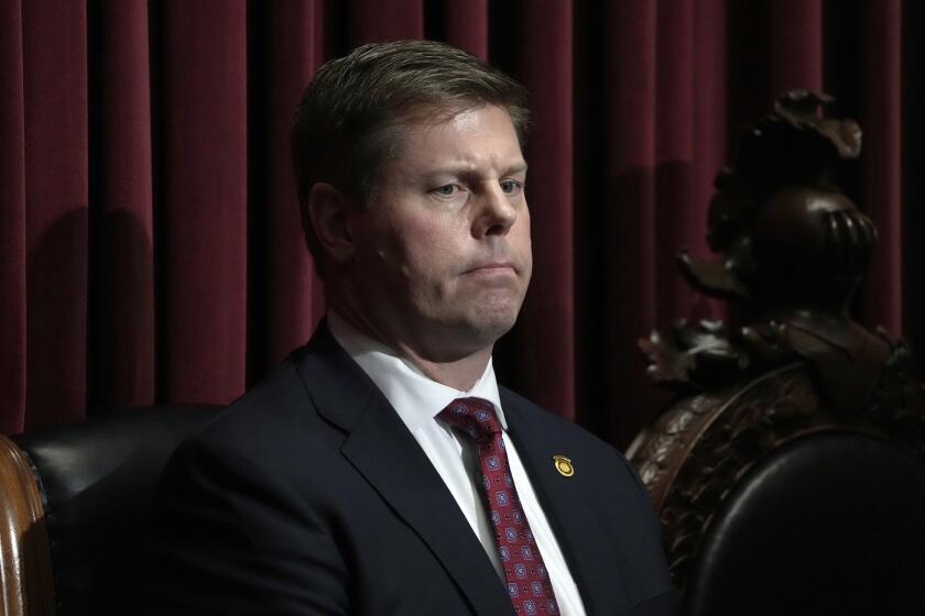 FILE - Missouri Speaker of the House Dean Plocher listens as Gov. Mike Parson delivers the State of the State address, Jan. 24, 2024, in Jefferson City, Mo. Plocher once described “stupid Republican women” as “an invasive species,” according to a whistleblower retaliation lawsuit filed against the powerful lawmaker Friday, May 31, 2024. (AP Photo/Jeff Roberson, File)