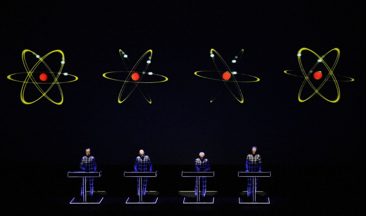 Kraftwerk, shown above at a Disney Hall concert in Los Angeles, will tour North America this summer.