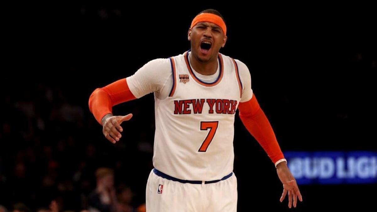 Knicks forward Carmelo Anthony (7) reacts after he is called for a foul in the fourth quarter against the Spurs on Feb. 12.