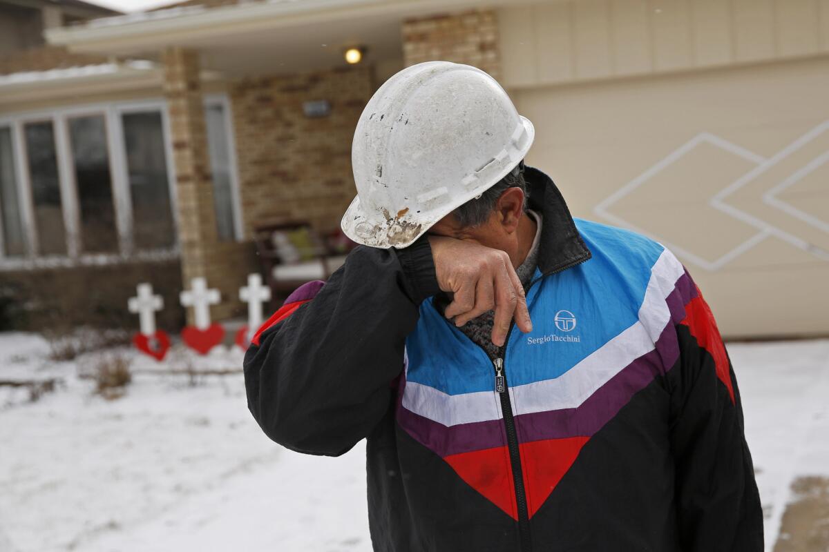 Greg Zanis wipes tears from his eyes Feb. 9, 2016, after he dropped off three white crosses with the names of a father, mother and their teenage son who were found dead in their Oak Forest home the previous night, an apparent murder-suicide. The bodies of David Joost, 54, Margaret O'Leary-Joost, 55, and Daniel Joost, 18, were discovered in the house in the 6600 block of Courtney Avenue about 8 p.m., according to police and the Cook County medical examiner's office.