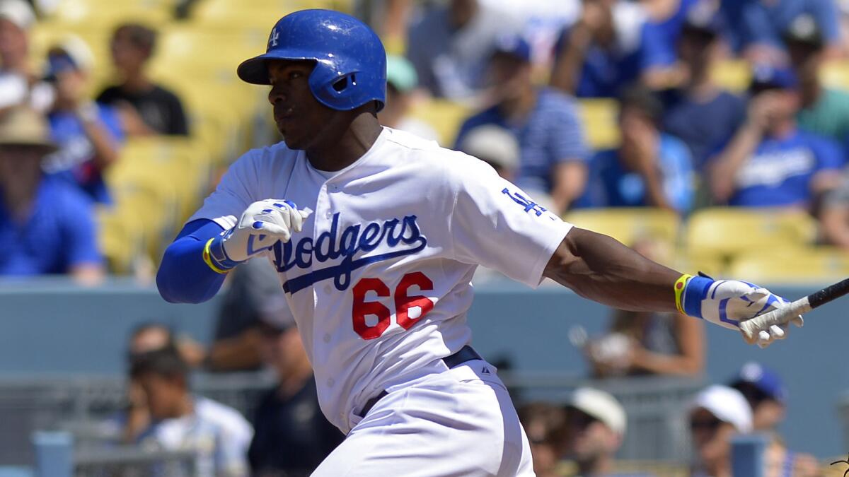 Dodgers right fielder Yasiel Puig hits a run-scoring single during the sixth inning of the Dodgers' 1-0 win over the San Diego Padres on Sunday.
