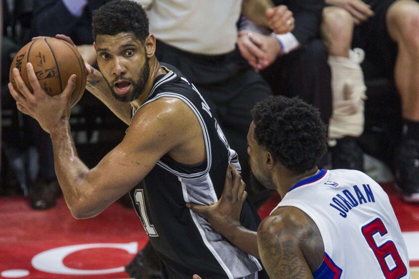 San Antonio's Tim Duncan faces the Clippers' DeAndre Jordan during the NBA playoffs in May.