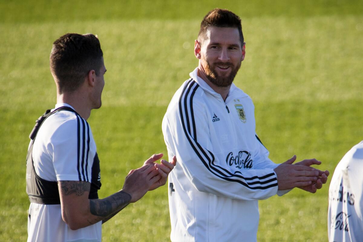 Argentina´s forward Lionel Messi (R) applauds during a training session at Ciudad Deportiva Antonio Asensio in Palma de Mallorca on November 12, 2019. (Photo by JAIME REINA / AFP) (Photo by JAIME REINA/AFP via Getty Images) ** OUTS - ELSENT, FPG, CM - OUTS * NM, PH, VA if sourced by CT, LA or MoD **