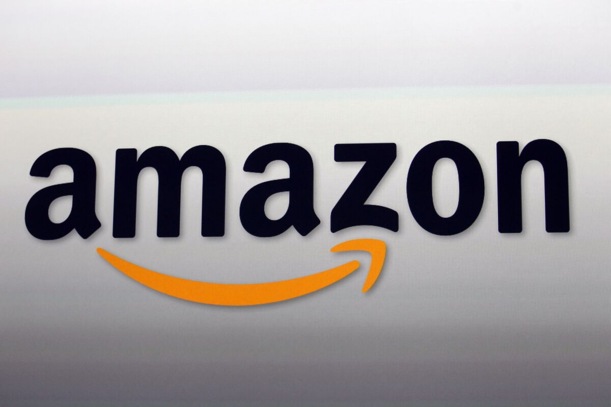 Shown is the logo for online merchant Amazon. The New York Times spent $30 million to buy two product review websites, the Wirecutter and the Sweethome, whose business models greatly rely on Amazon.