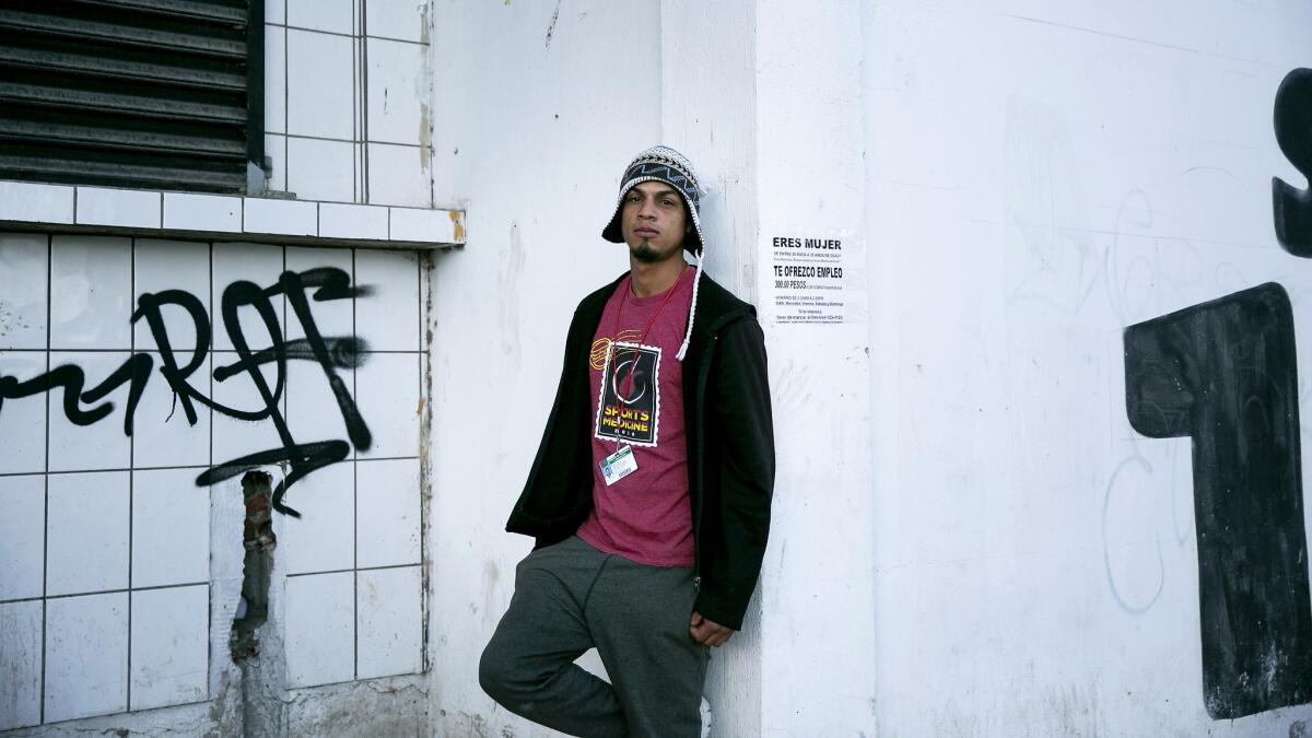 Juan Carlos Caballero Jones, who witnessed tear gas being fired at the border early New Year's Day, poses for a portrait outside the El Barretal shelter in the Mariano Matamoros neighborhood of Tijuana.