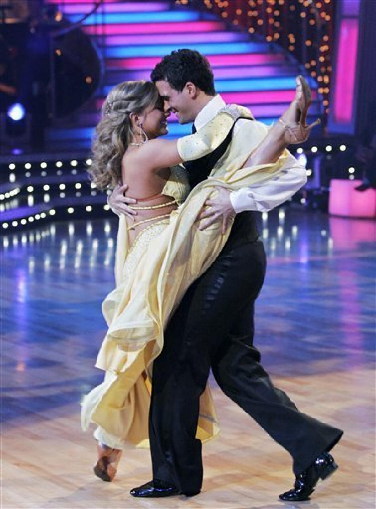 FILE - In this March 9, 2009 file photo released by ABC, Shawn Johnson, left, and her partner Mark Ballas perform on "Dancing with the Stars," in Los Angeles. A reader-submitted question about how the show's celebrity contestants and professional dancers are paid is being answered as part of an Associated Press Q&A column called "Ask AP".(AP Photo/ABC, Kelsey McNeal, File)