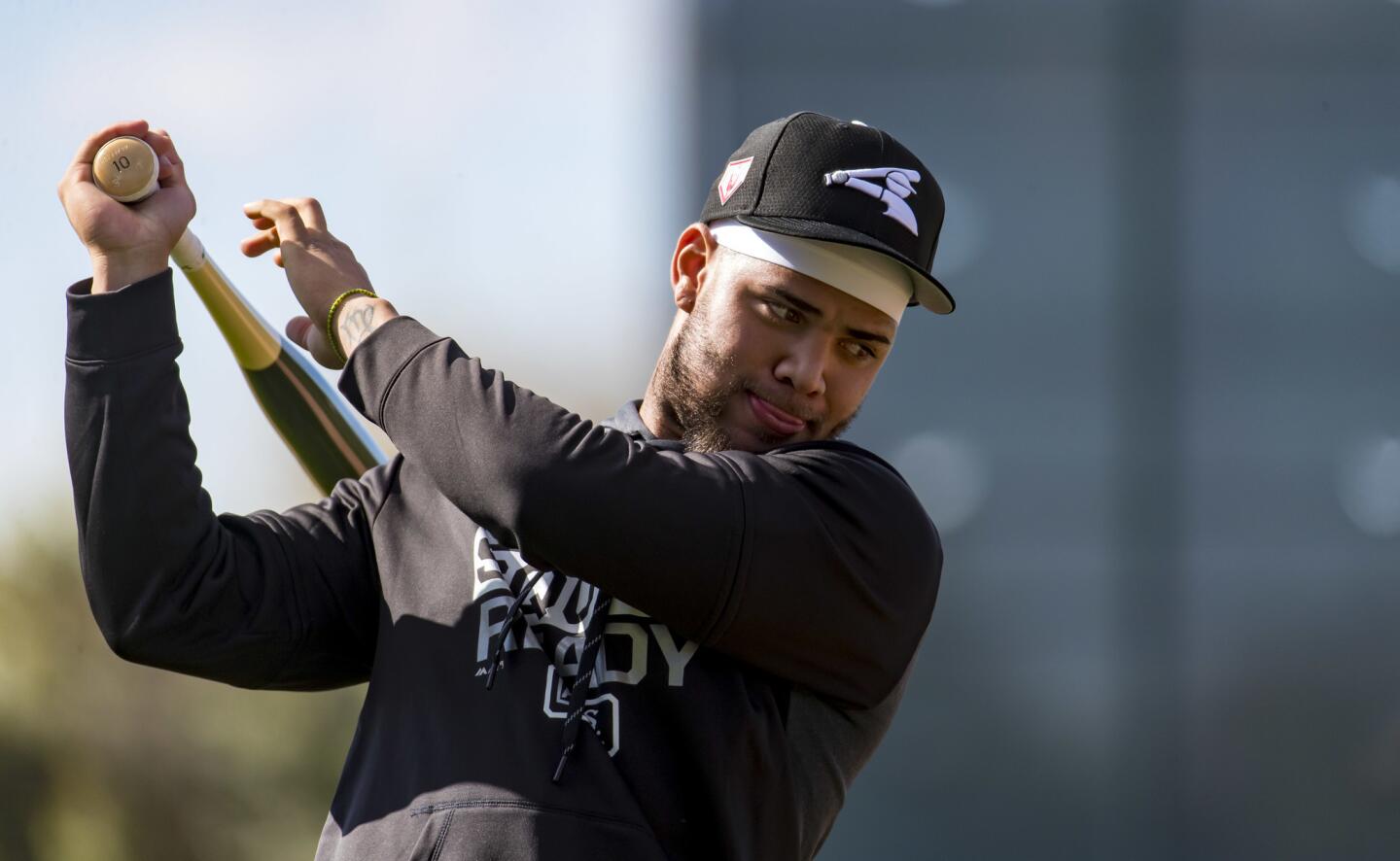 White Sox second baseman Yoan Moncada takes a practice swing during spring training at Camelback Ranch in Glendale, Ariz., on Saturday, Feb. 16, 2019.