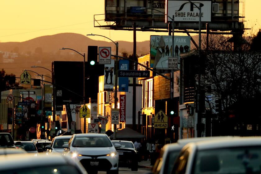 LOS ANGELES, CALIF. - MAR. 1,, 2021. Motor traffic streams down Melrose Avenue on Monday, Mar. 1, 2021. (Luis Sinco/Los Angeles Times)