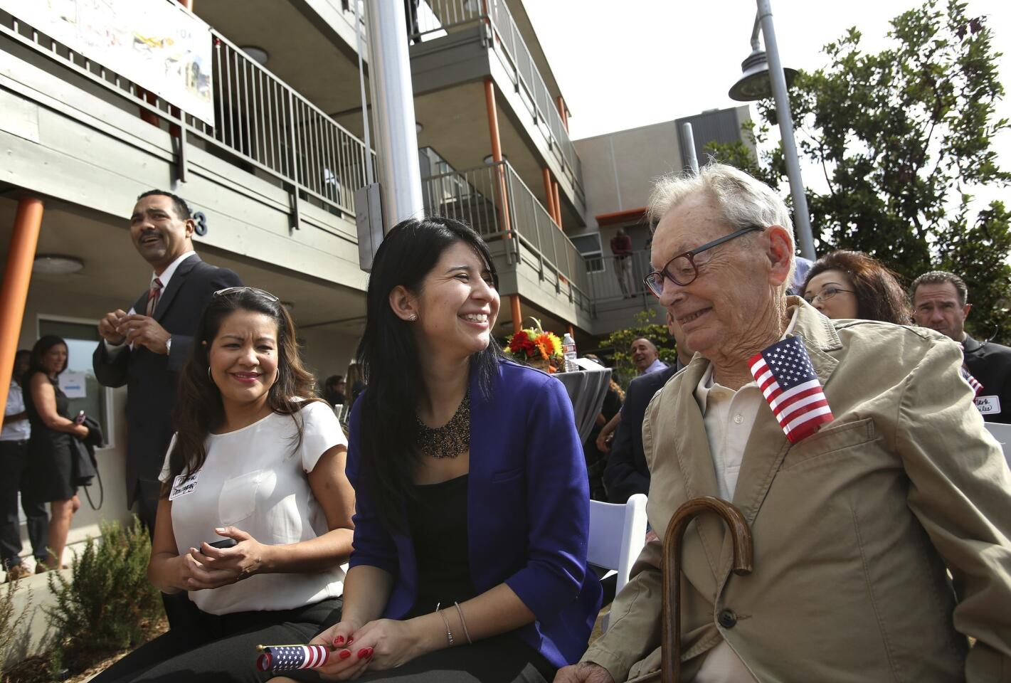 Philip Pescar, 89, right, a World War II veteran and new resident of the Guy Gabaldon Apartments, at the grand opening celebration Monday of the first affordable housing development for homeless senior veterans on the Eastside.